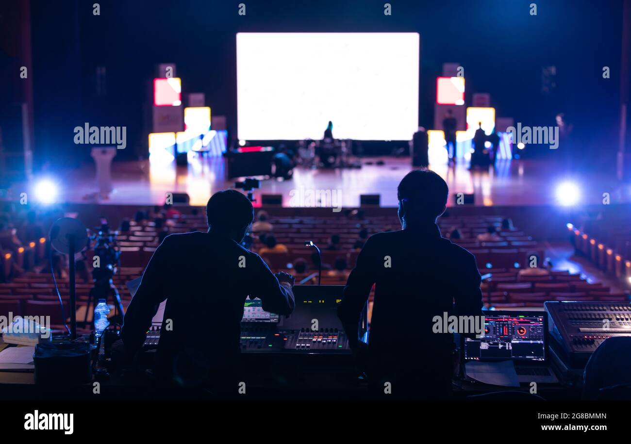 Blur image of sound engineer team working to prepare for music concert