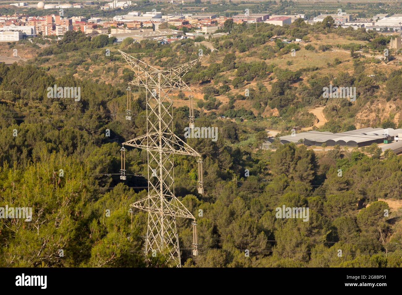 Tower supporting copper cables to transport electric energy, in the