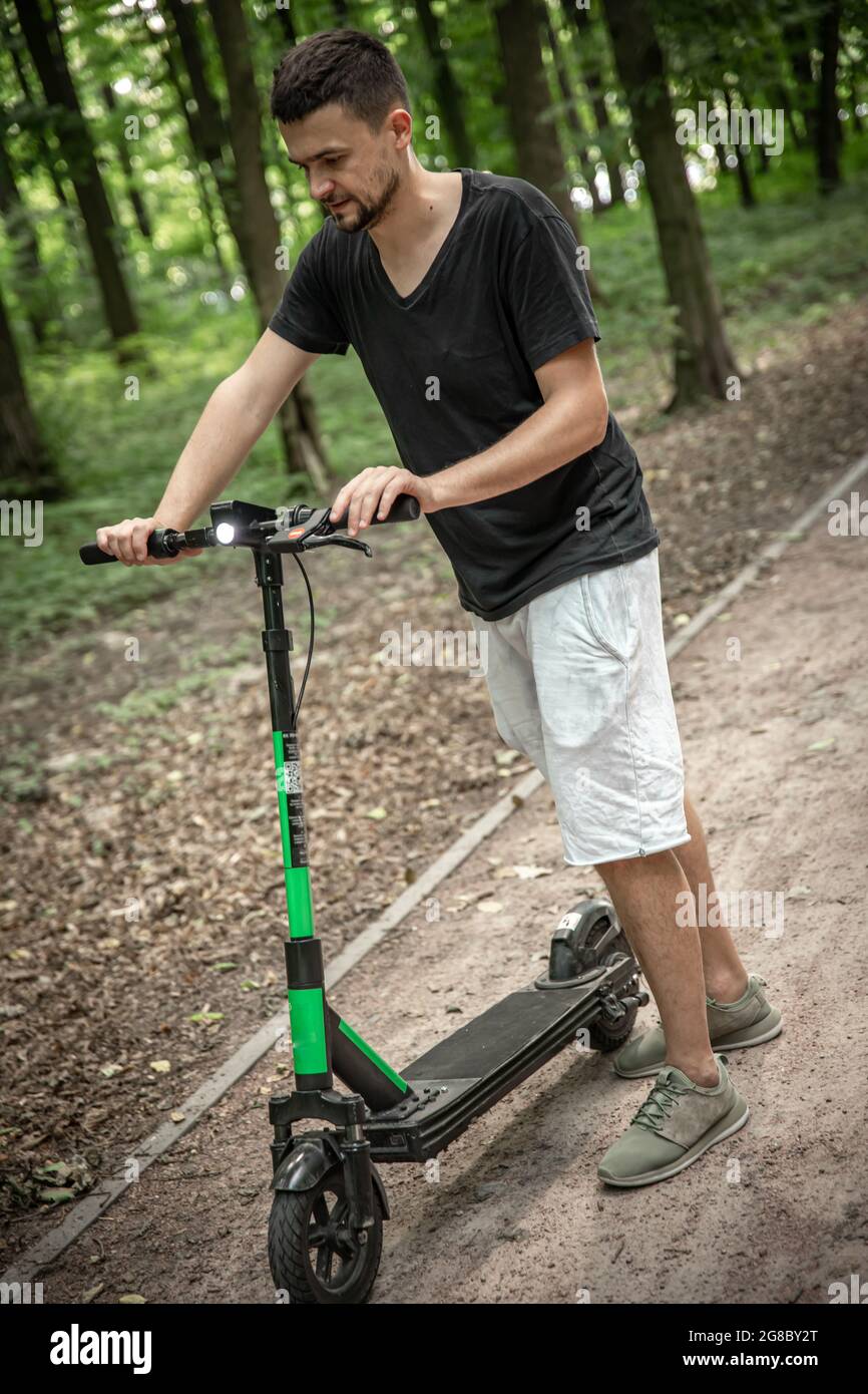 Happy young man scooter hi-res stock photography and images - Alamy