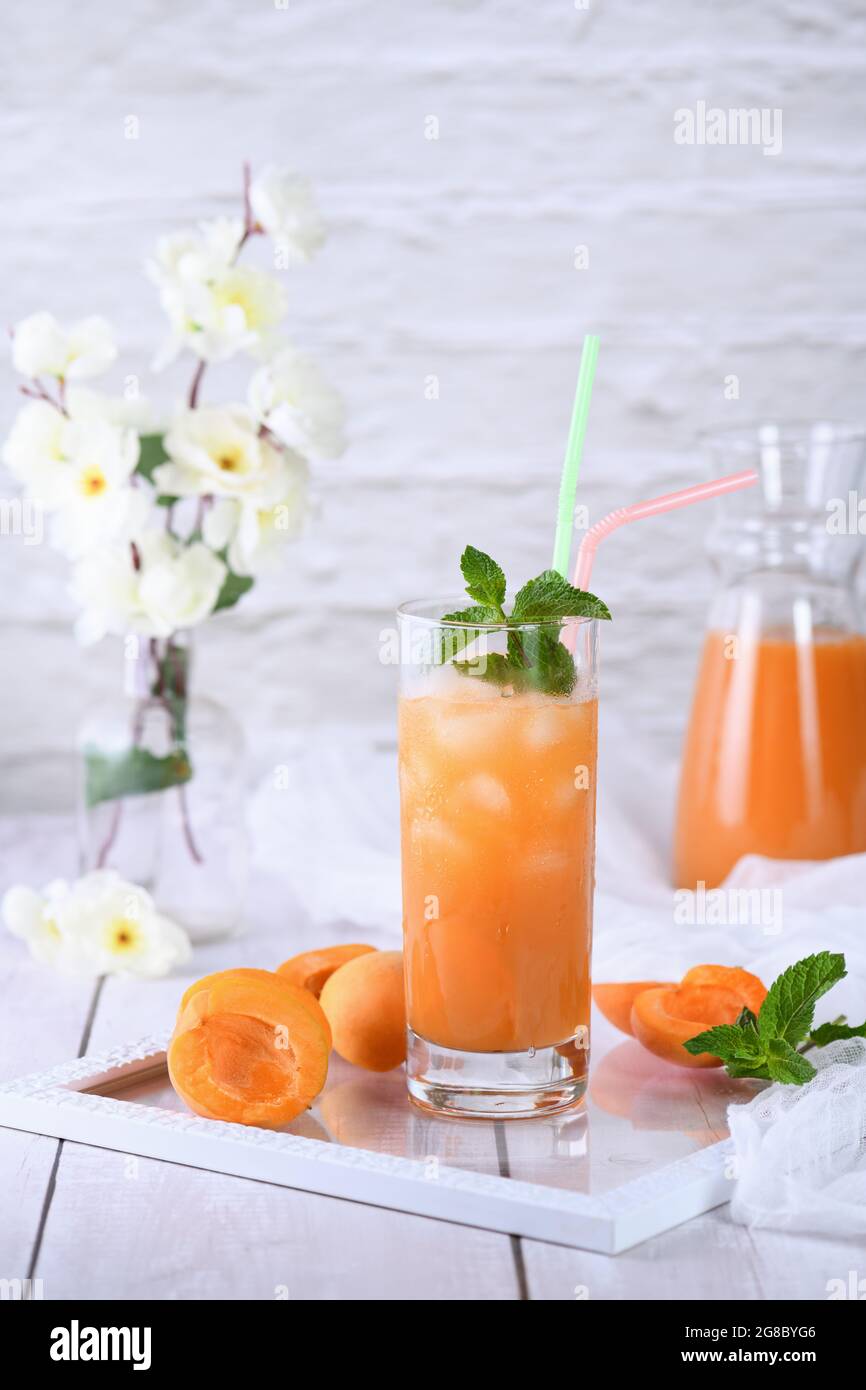 Refreshing, freshly cooked nonalcoholic cocktail made from apricot juice and mint Stock Photo