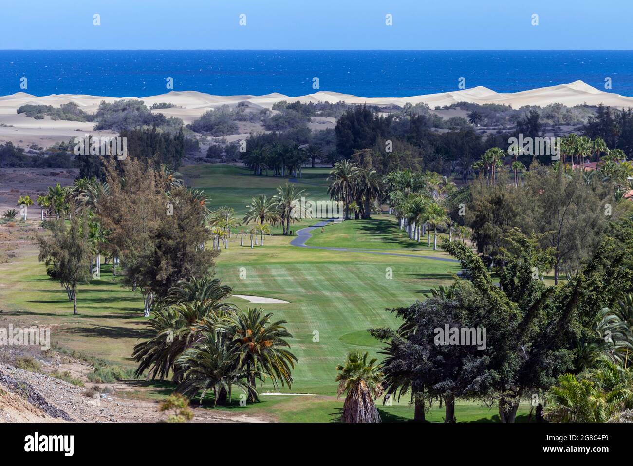 Golf course in Maspalomas, Gran Canaria with the sand dunes in the  background Stock Photo - Alamy