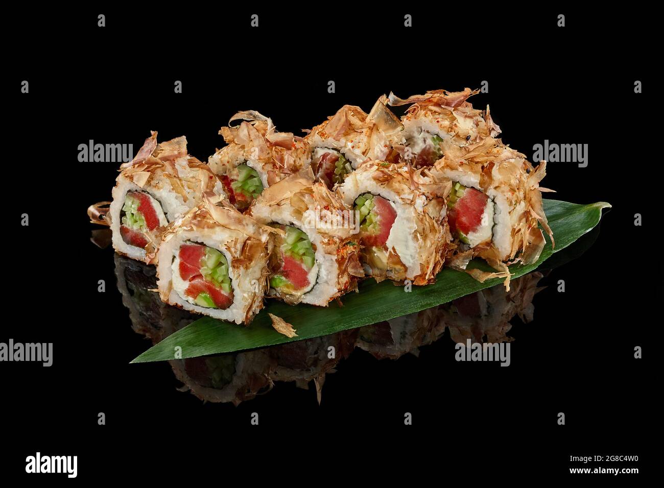 Sushi rolls with bonito flakes, tuna, cheese cream and cucumber Stock