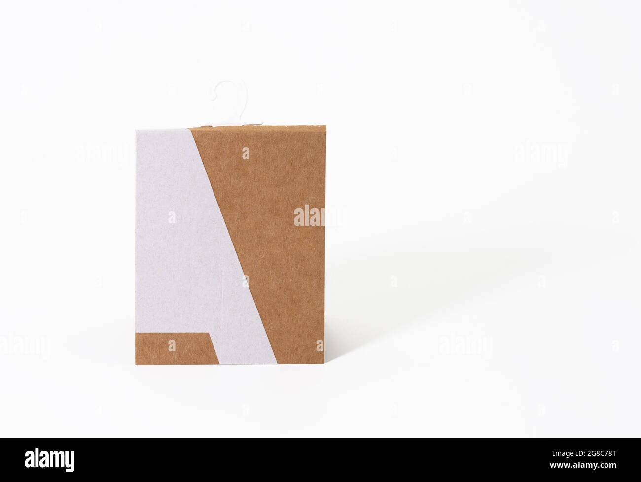 rectangular brown paper tag with sock hook on white background Stock Photo