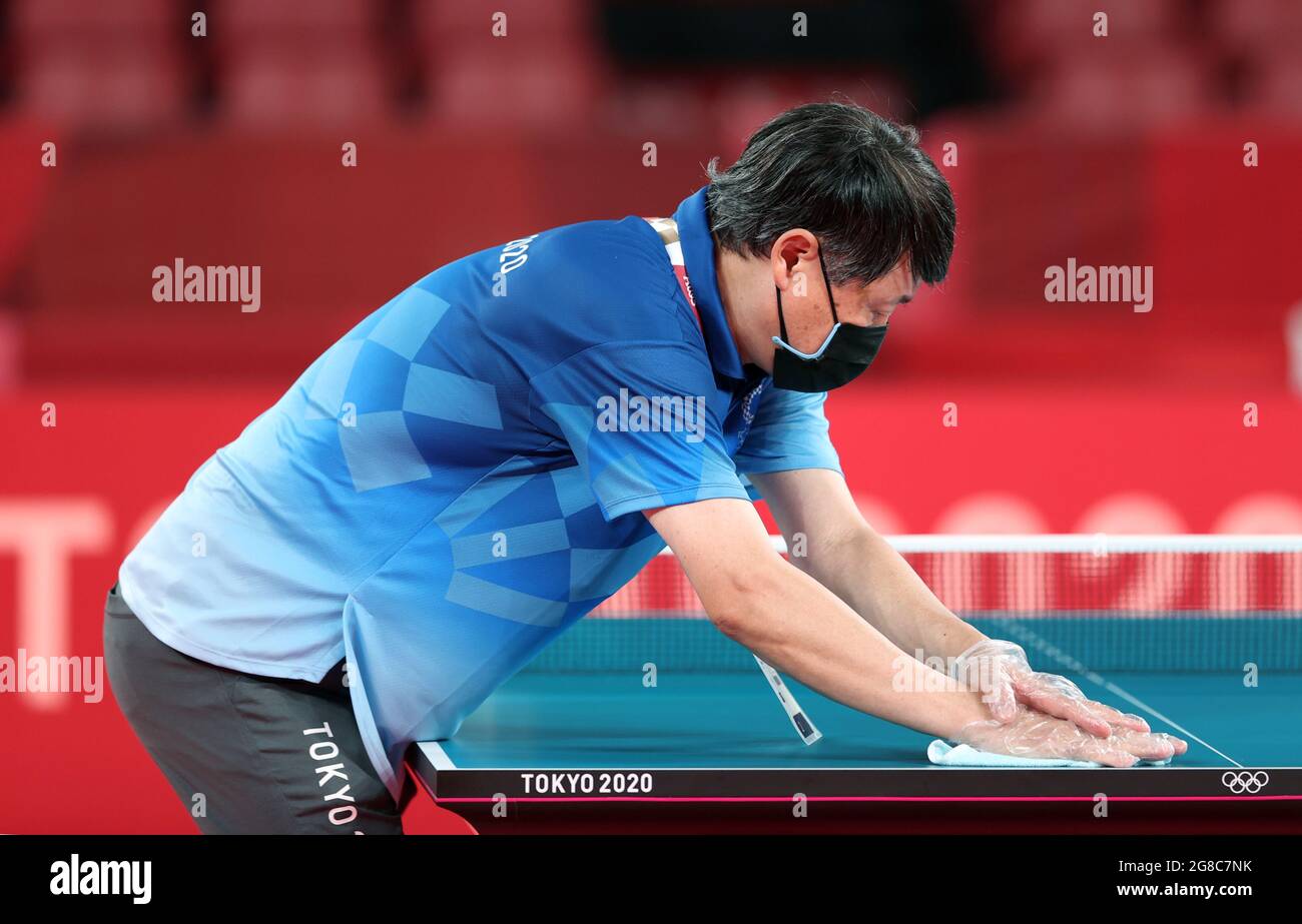 Tokyo, Japan. 19th July, 2021. A staff disinfects a table tennis table at Tokyo Metropolitan Gymnasium in Tokyo, Japan, July 19, 2021. Credit: Wang Dongzhen/Xinhua/Alamy Live News Stock Photo