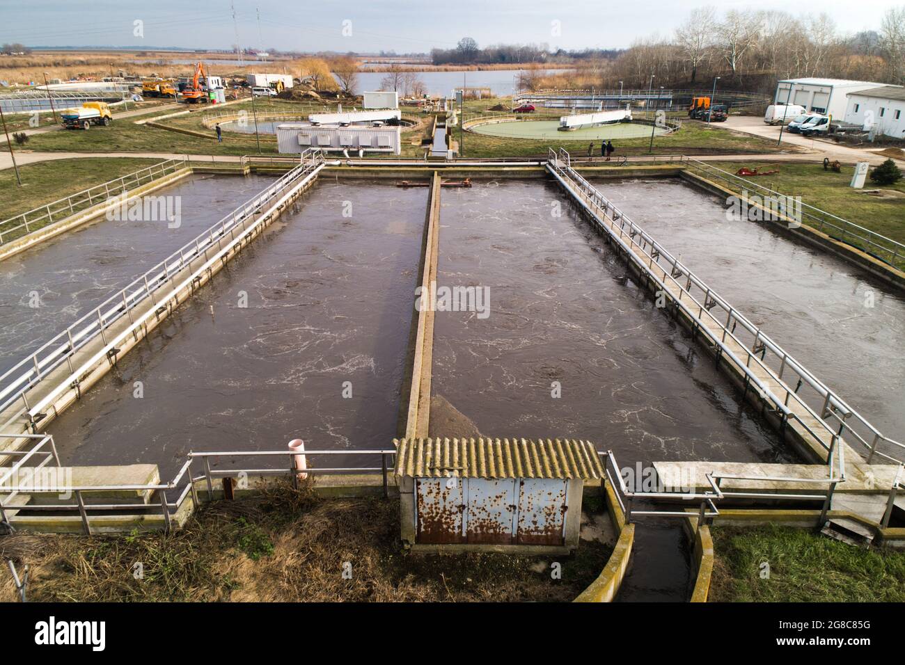 Water Treatment Facility Pools. Complete view of a waste water sewage treatment facility. Stock Photo