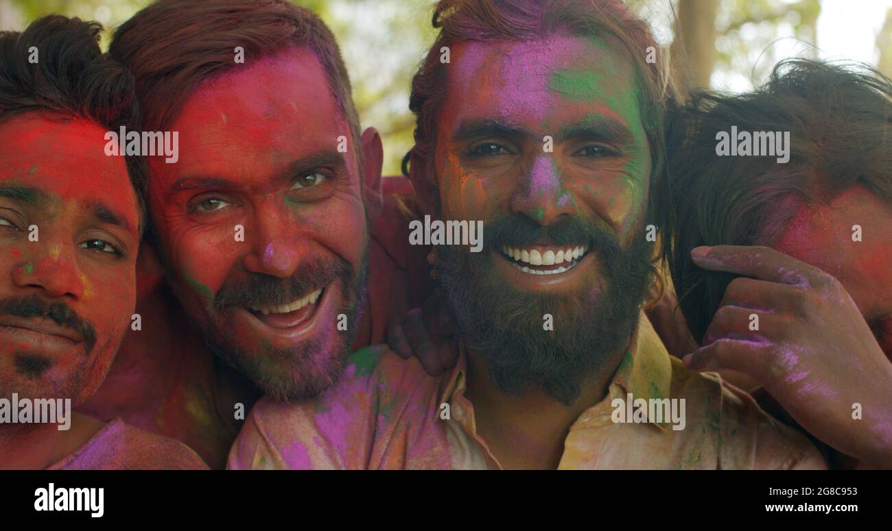 Group of funny guys with painted faces is enjoying the Holi festival Stock  Photo - Alamy