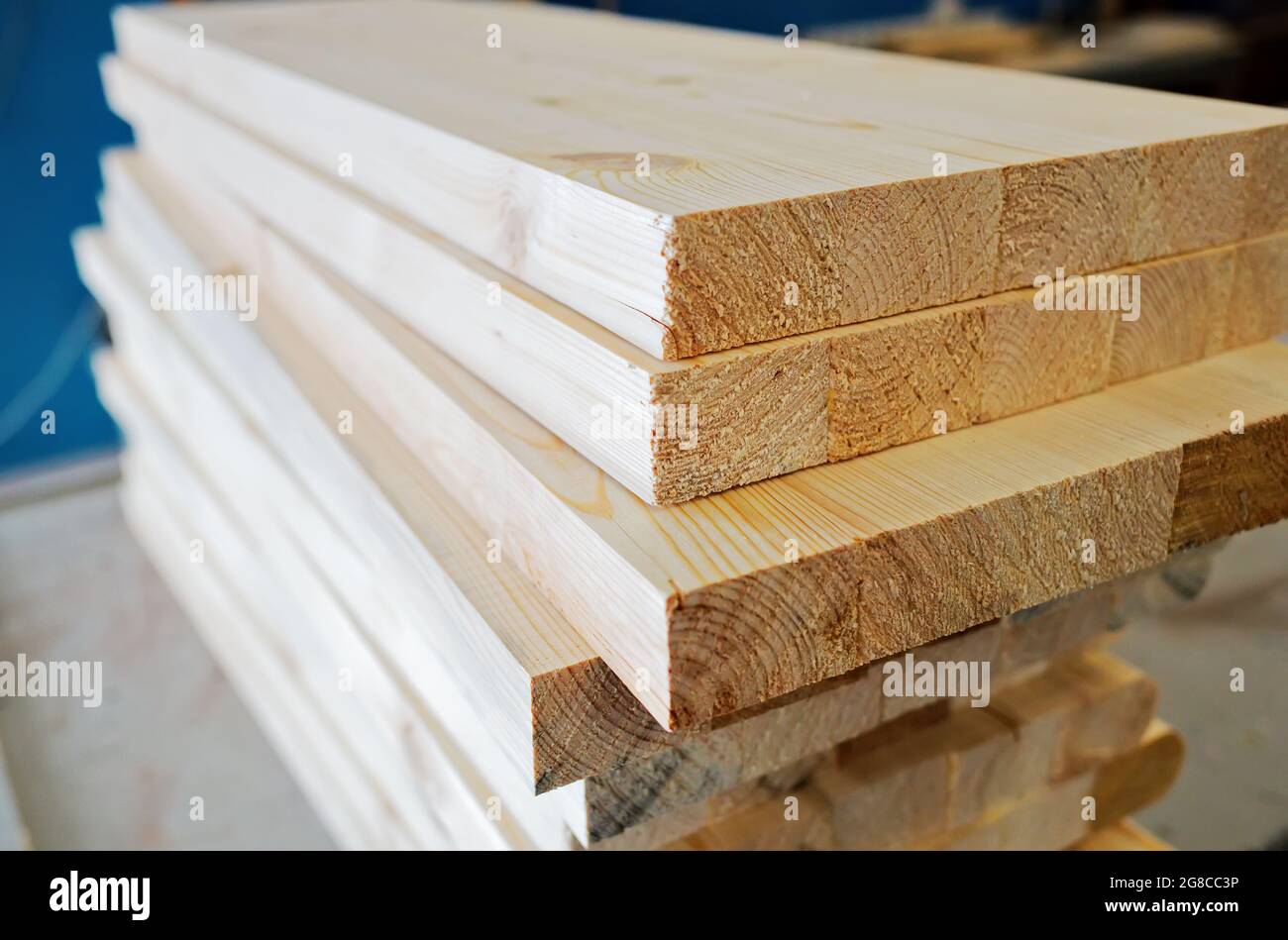 Boards and construction lumber lie in the carpentry