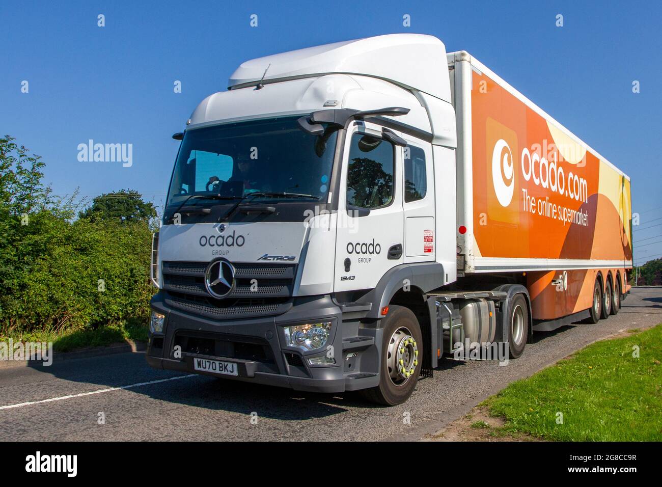 Ocado depot supermarket delivery vans hires stock photography and