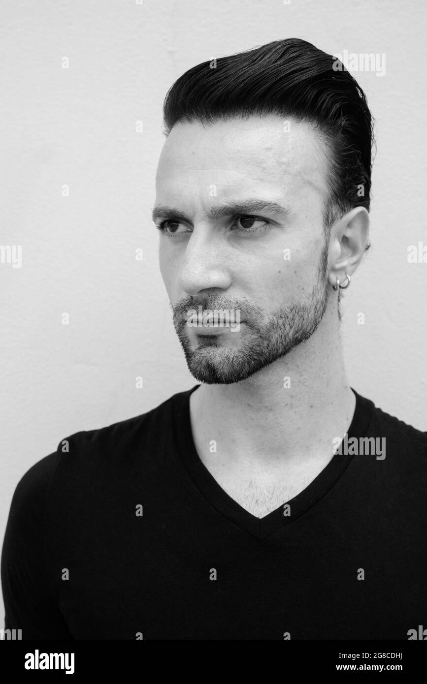 Black and white portrait of handsome Italian man thinking Stock Photo