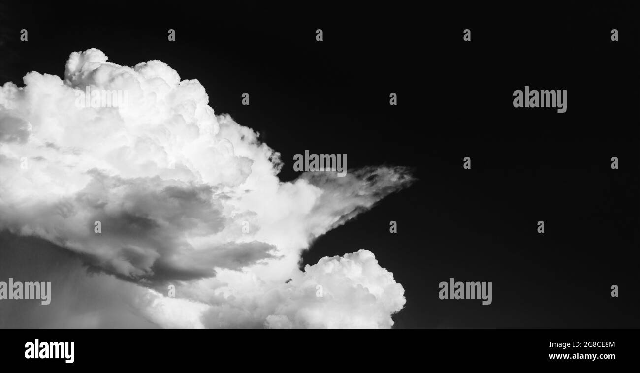 big white cloud in a blue sky, black and white photo Stock Photo - Alamy