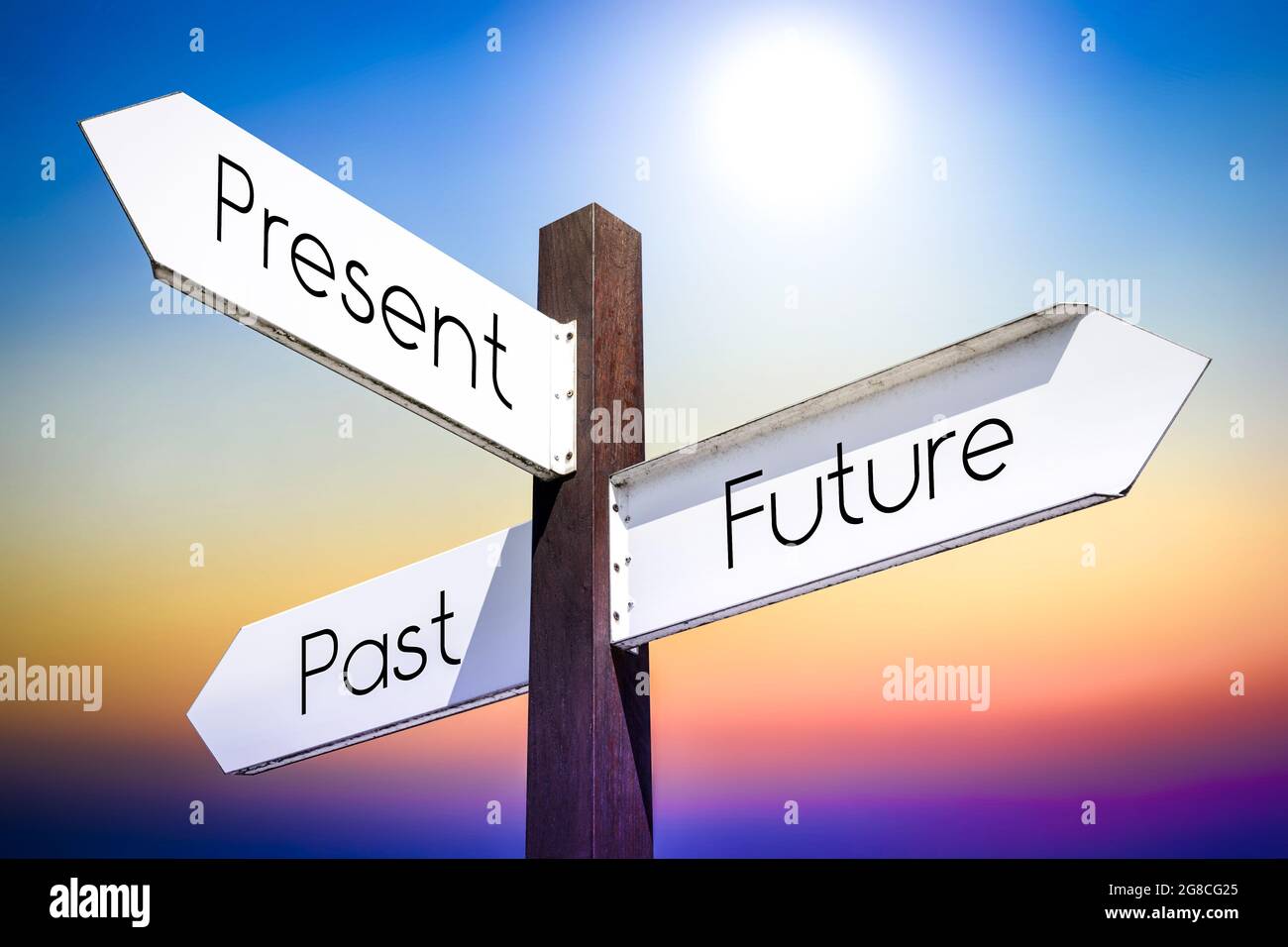 Future, present, past concept - signpost with three arrows Stock Photo