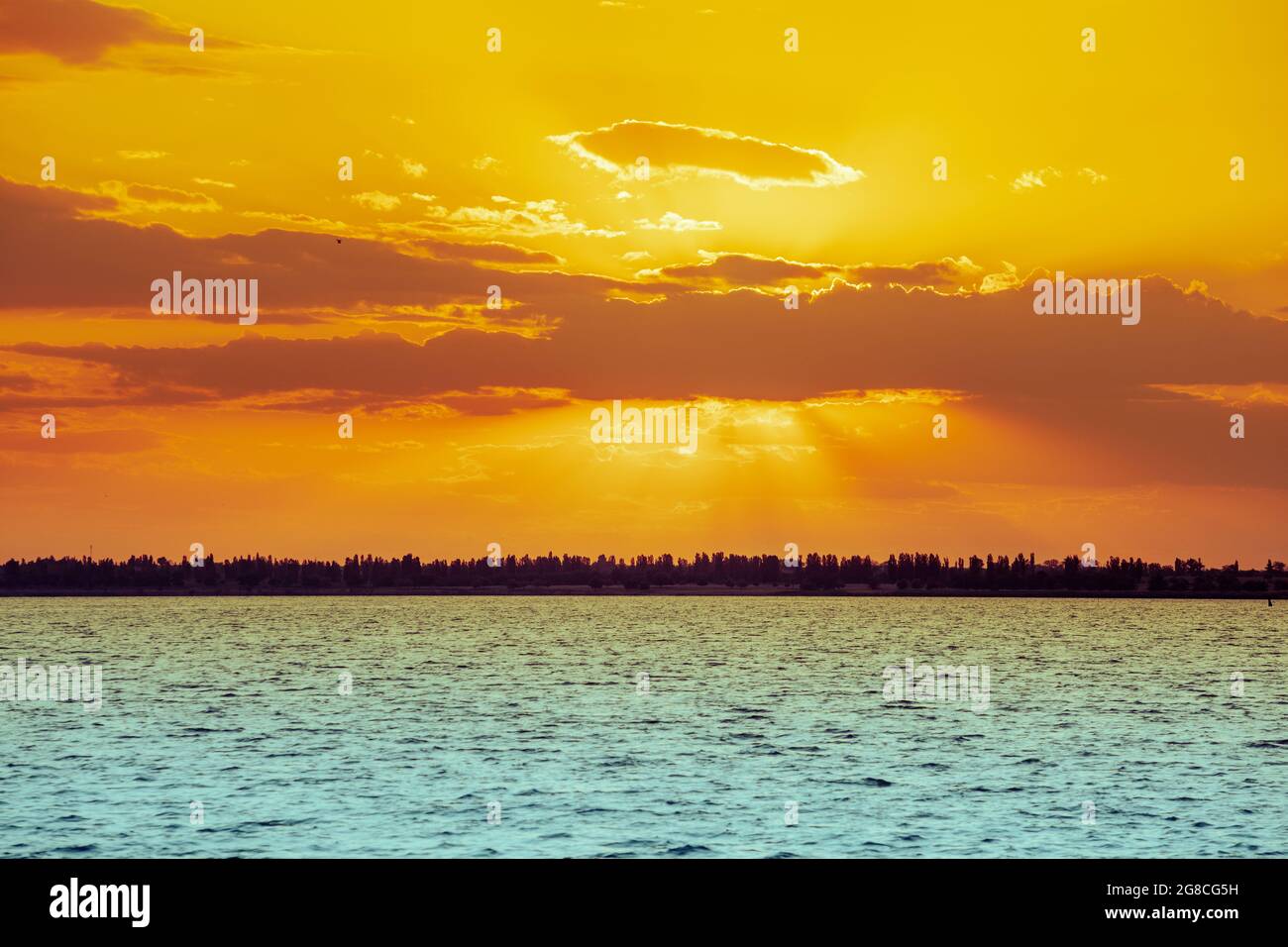 Seascape in the evening. Golden sunset over the sea with beautiful sky ...