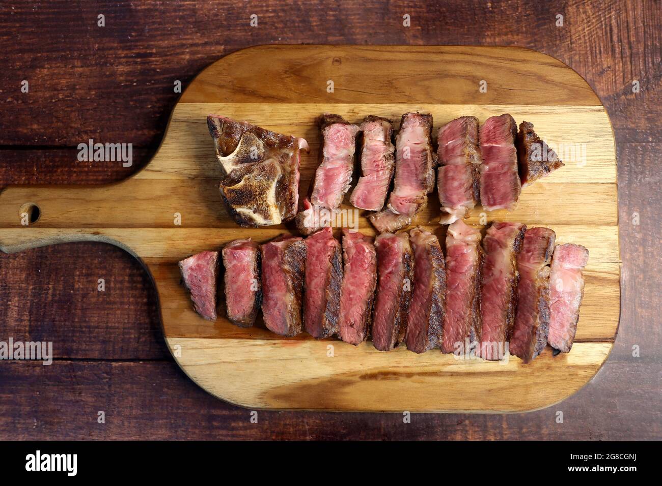 Short Rib or Costela Premium. Beautiful Steak sliced on a wooden board. Rare Steak sliced. Stock Photo