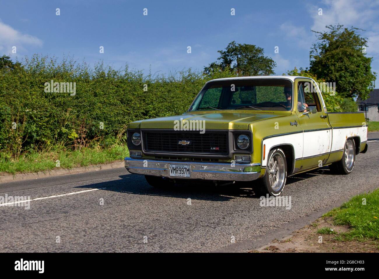 1974 70s green American Chevrolet two-tone C10 Work Truck pickup, en-route to Capesthorne Hall classic July car show, Cheshire, UK Stock Photo