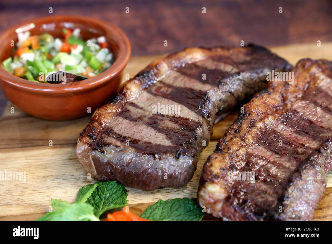 Picanha. Brazilian steak grilled in barbecue. Two slices of Picanha