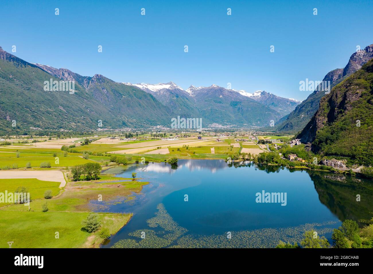 Panoramic aerial view of Valchiavenna with Laghetto Pozzo di Riva from Novate Mezzola Stock Photo