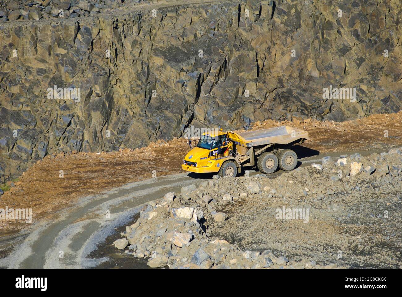 Caterpillar 725 articulated dump truck working in a quarry in England. Stock Photo