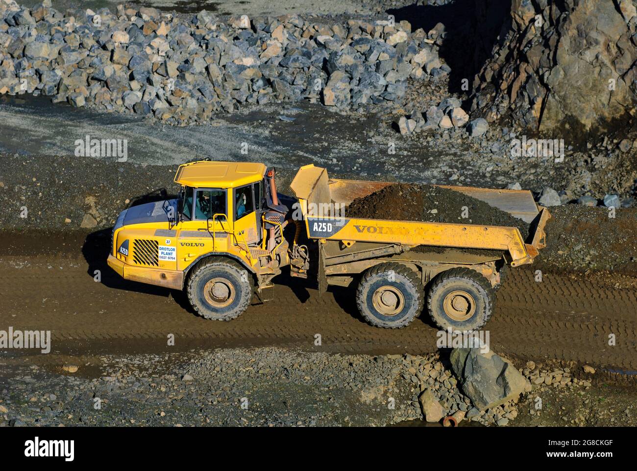 Volvo A25D articulated dump truck working in a quarry in England. Stock Photo