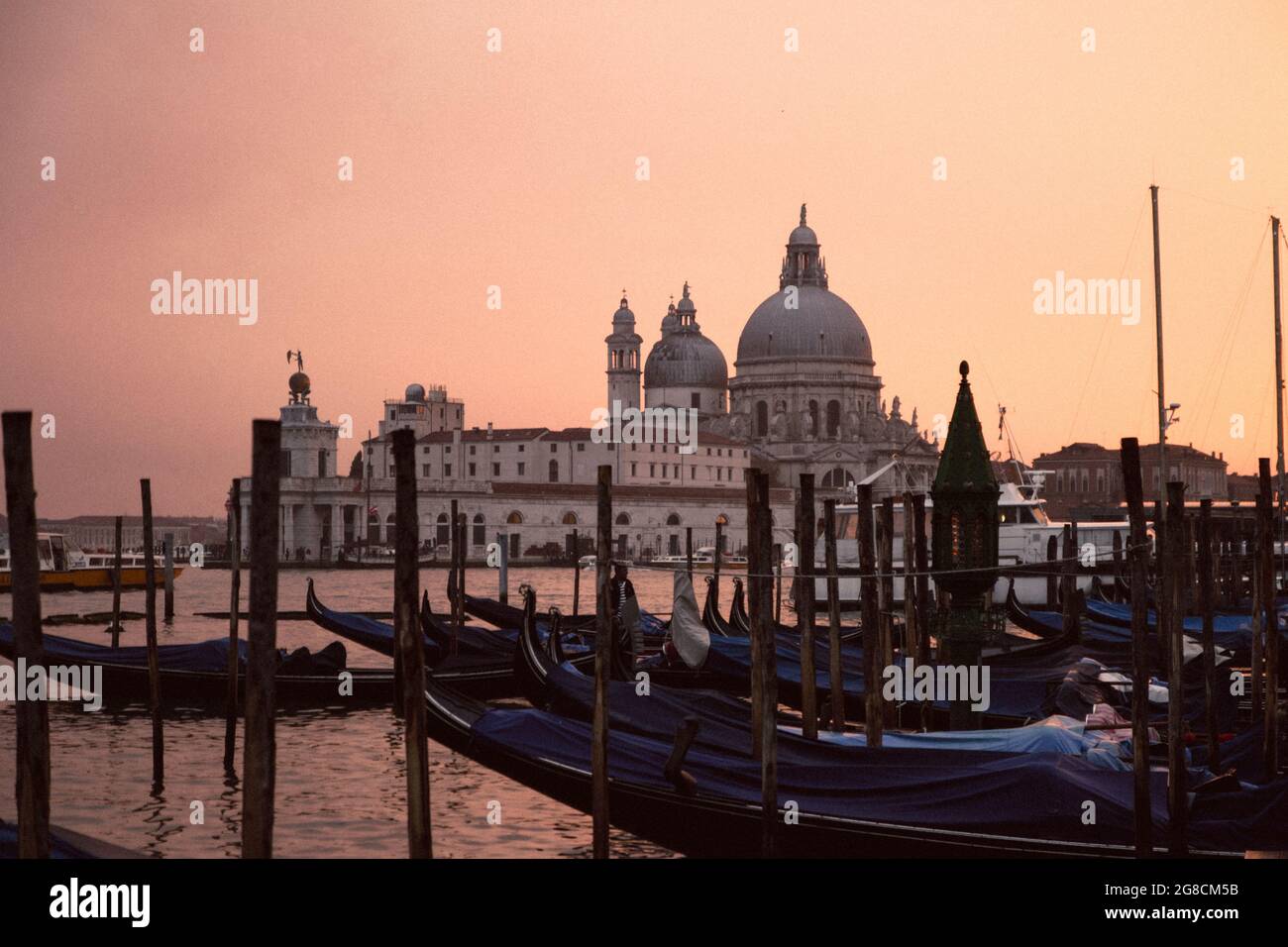 the sunset in venice with its gondolas Stock Photo - Alamy