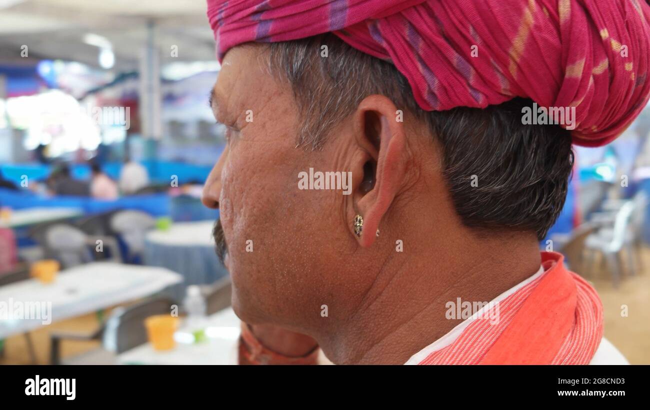 Portrait of a middle-aged Indian male with a mustache and pink turban Stock Photo