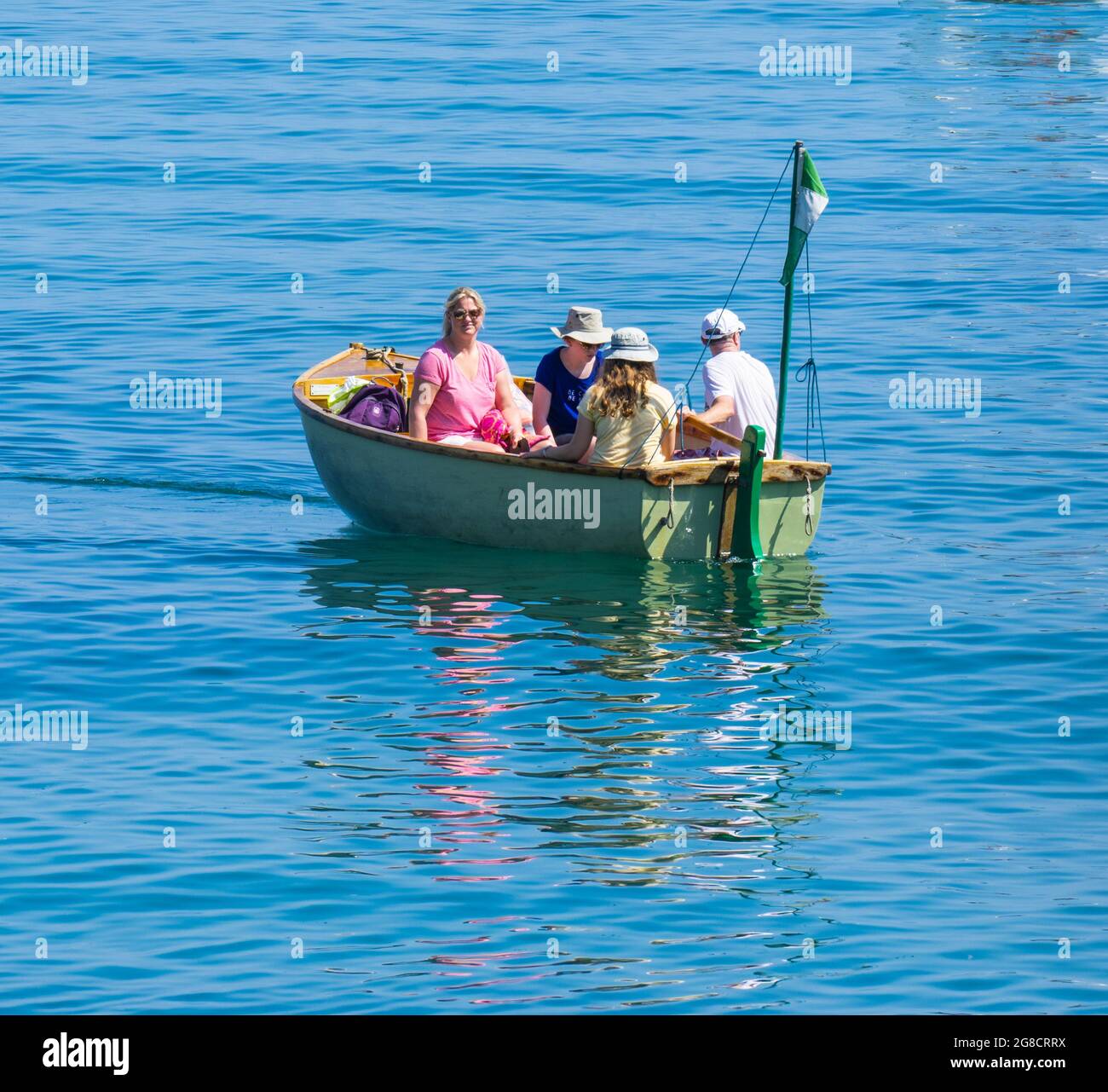 Beer, East Devon; 19th July 2021. UK Weather: Holidaymakers enjoy the glorious sunshine relaxing on the beach and cooling off in the blue sea at the pretty fishing and seaside village of Beer, East Devon. Credit: Celia McMahon/Alamy Live News Stock Photo