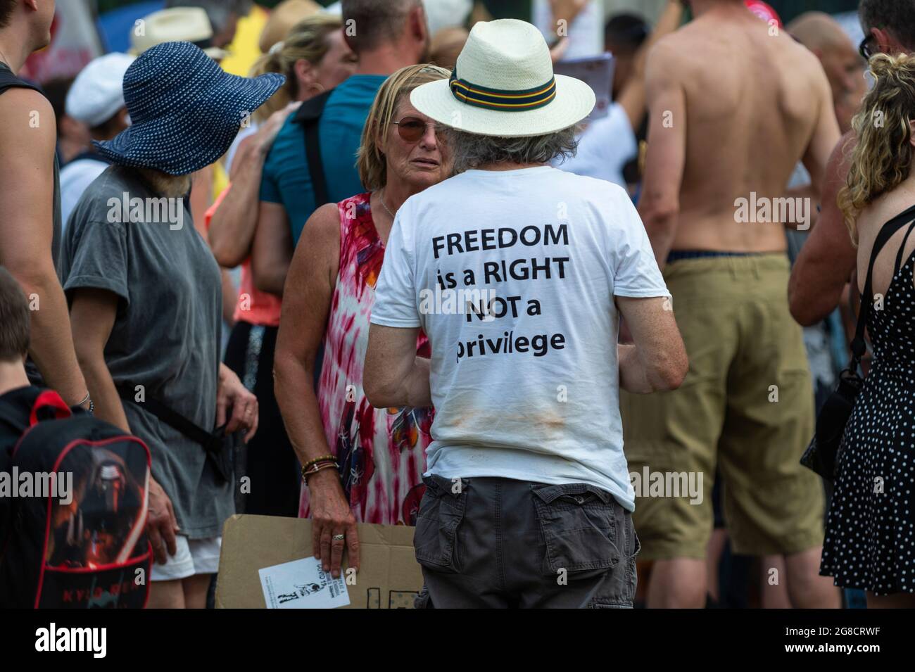 London, UK.  19 July 2021.  People at an anti-vaccine protest in Parliament Square, on what has been dubbed Freedom Day, when the UK government relaxed remaining coronavirus lockdown restrictions but the numbers of positive cases continues to increase daily and scientists are concerned that restrictions have been eased too soon. Credit: Stephen Chung / Alamy Live News Stock Photo