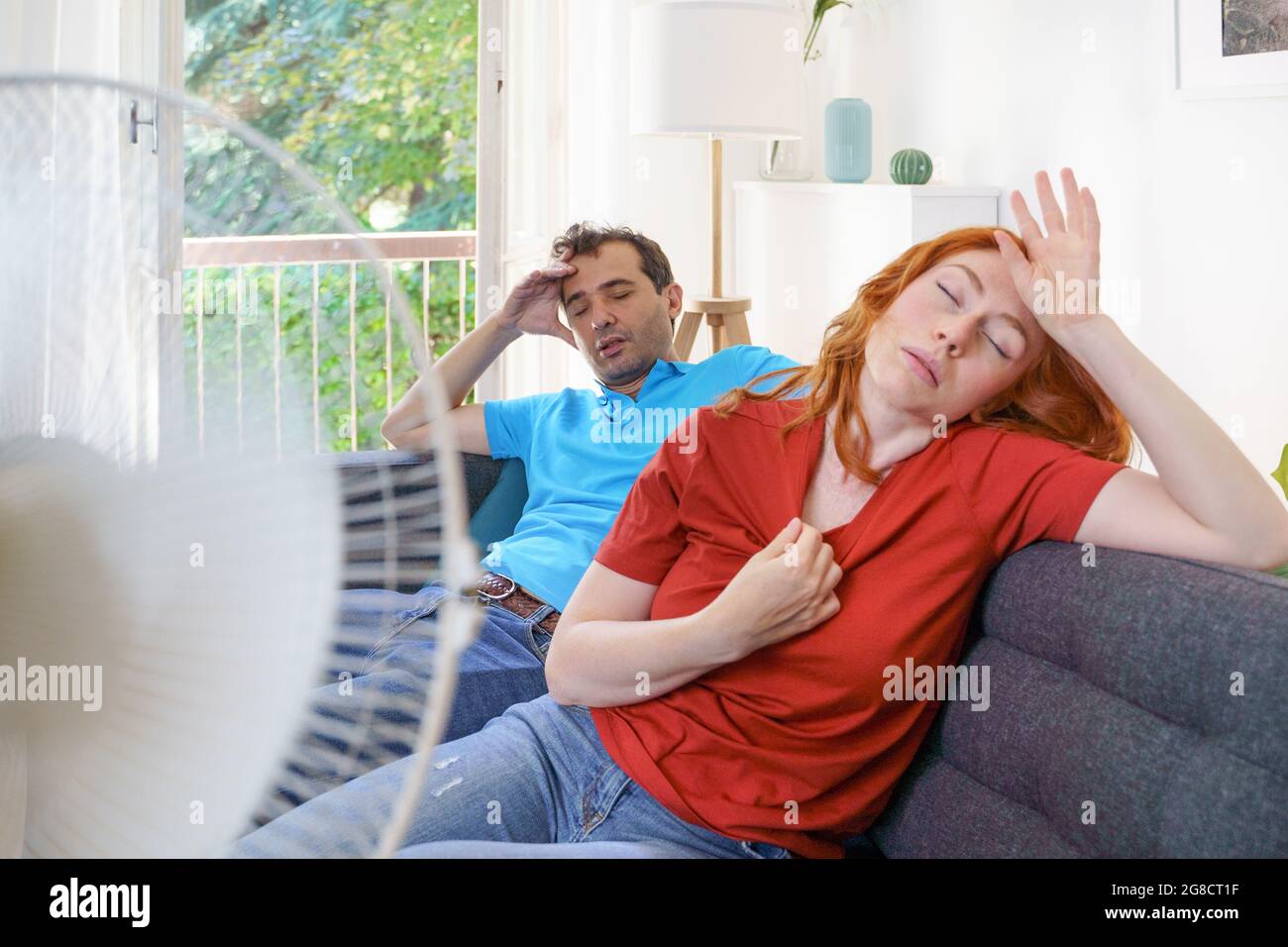 Couple sweating and feeling bad for hot weather Stock Photo Alamy