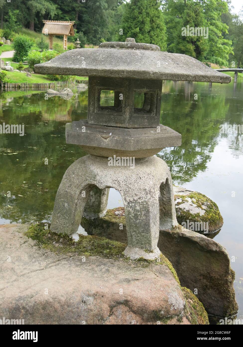 Stone lanterns are just one of the oriental features in the Japanese garden at Cowden, established by Ella Christie after her travels in early 1900s. Stock Photo