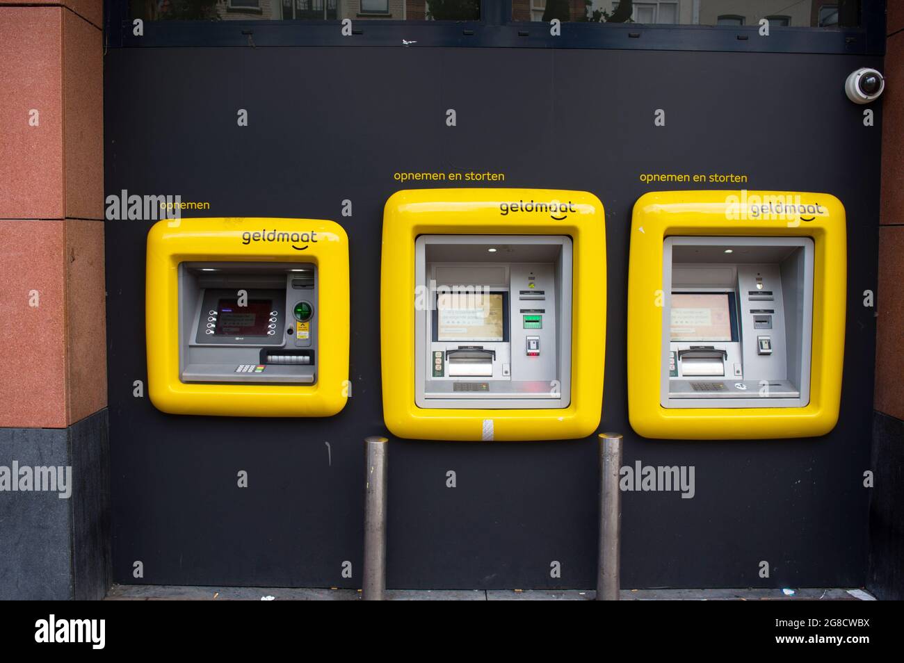 Nijmegen, Netherlands - June 26, 2021: Yellow geldmaat machines in a row,a dutch ATM banking machine, translation: geldmaat means money measure Stock Photo