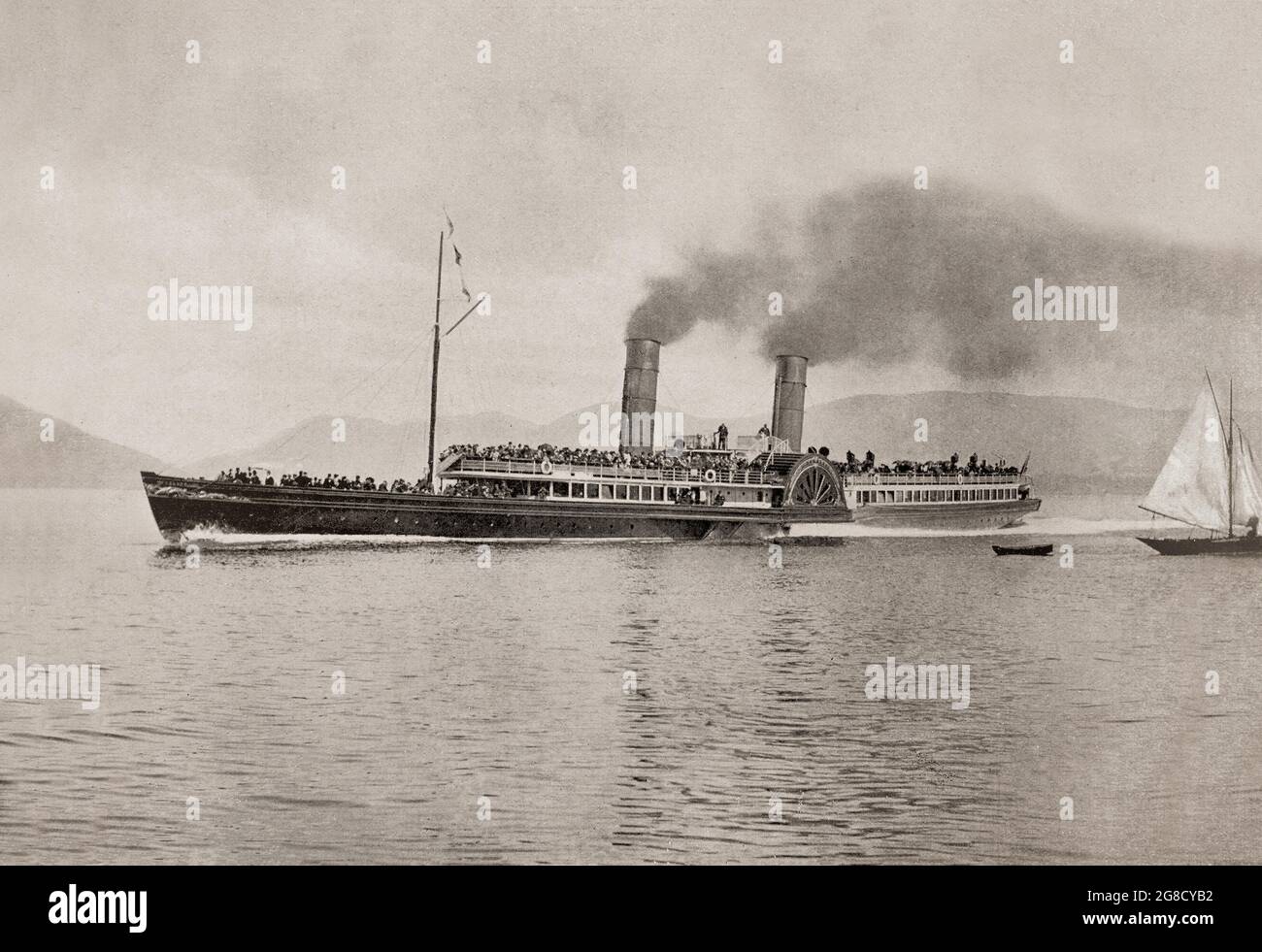A late 19th century view of RMS Columba, a Clyde paddle steamer, that ran the first leg of "The Royal Route" to Ardrishaig calling at Rothesay and the Kyles of Bute for fifty eight summers. She was built by J & G Thomson of Clydebank, and was the flagship of the MacBrayne fleet from 1879 to 1935 and often considered the finest Clyde steamer of all time. Stock Photo