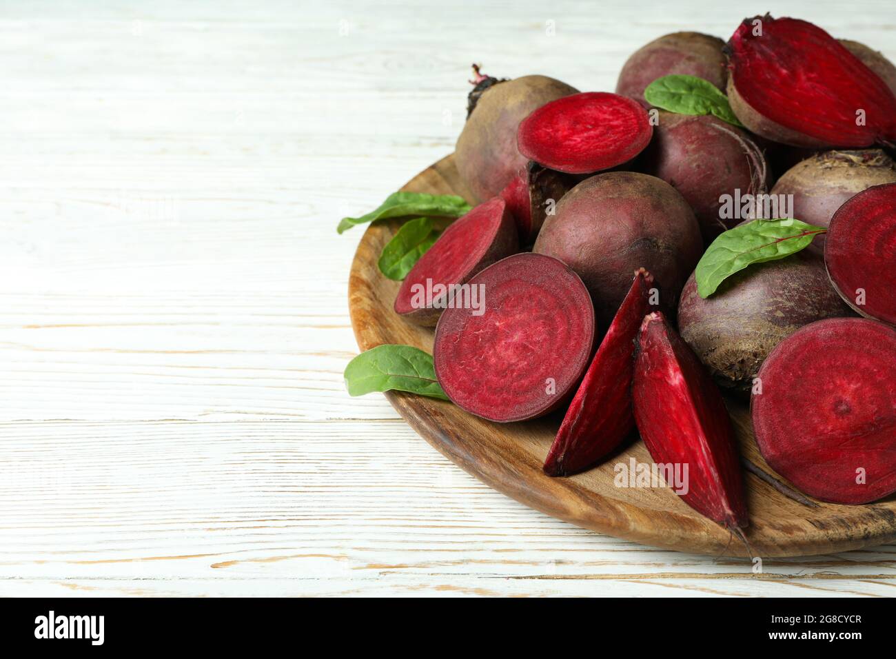 Ripe red beet on white wooden table Stock Photo