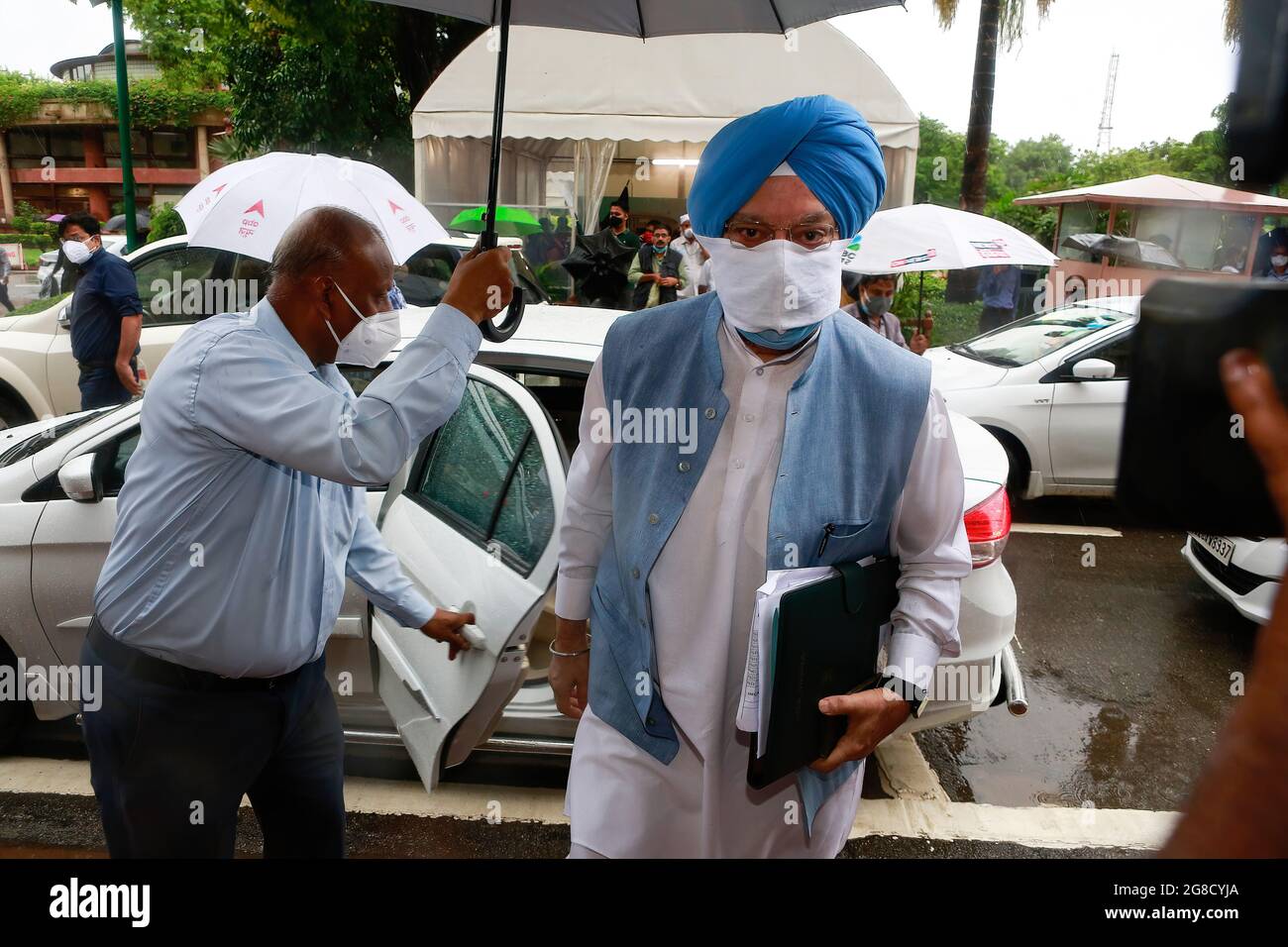 Indian Union Minister for Petroleum and Natural Gas and Minister of Housing and Urban Affairs, Hardeep Singh Puri arrives on the opening day of the Monsoon session at Parliament House in New Delhi. Stock Photo