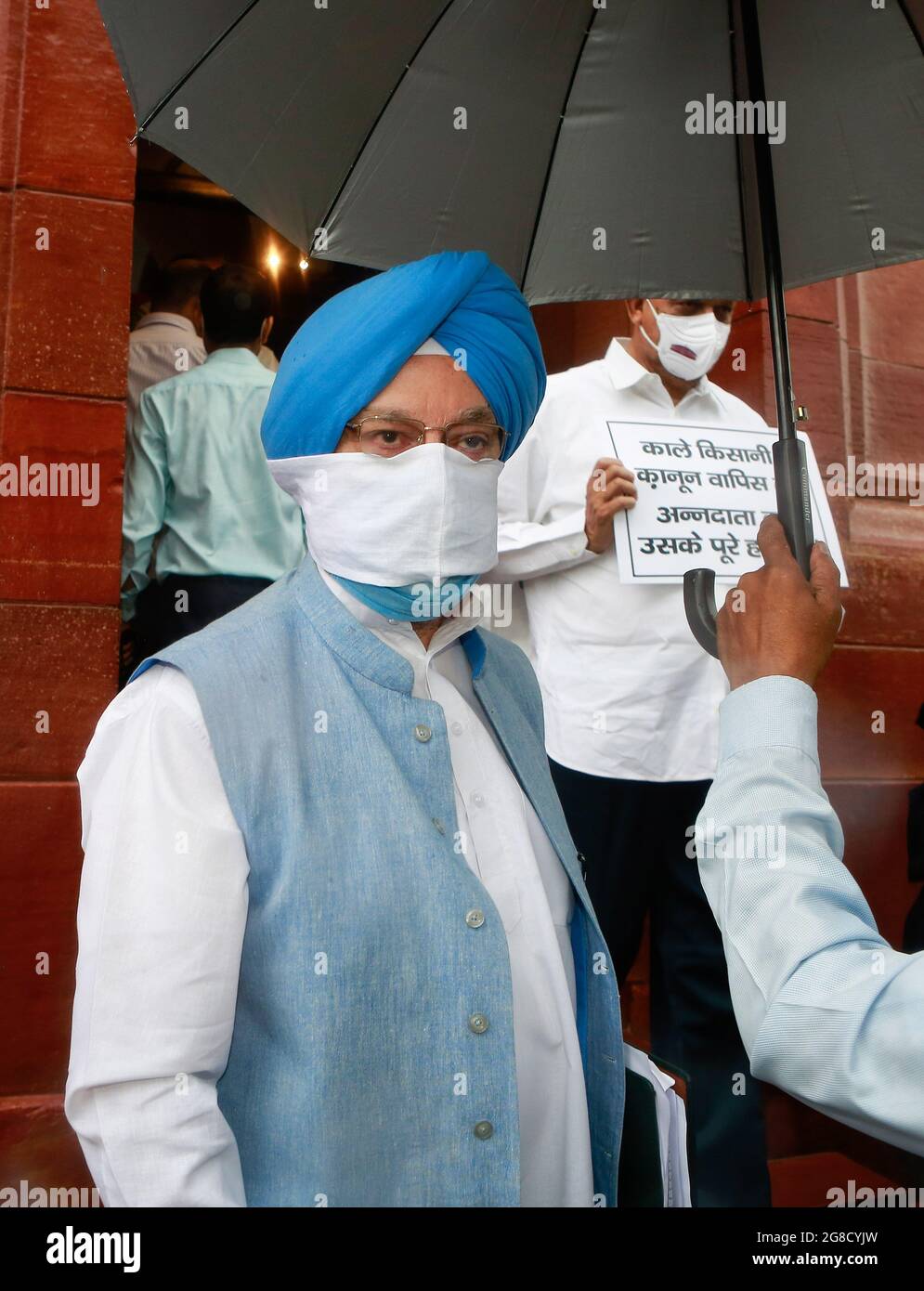 Indian Union Minister for Petroleum and Natural Gas and Minister of Housing and Urban Affairs, Hardeep Singh Puri arrives on the opening day of the Monsoon session at Parliament House in New Delhi. Stock Photo