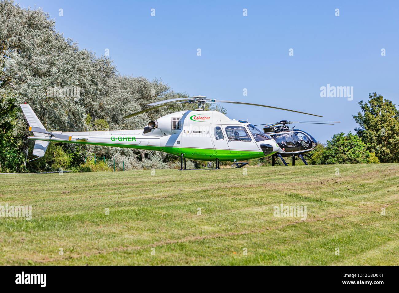 a-gallagher-and-a-mcdonnell-douglas-helicopter-landed-on-grassland-near