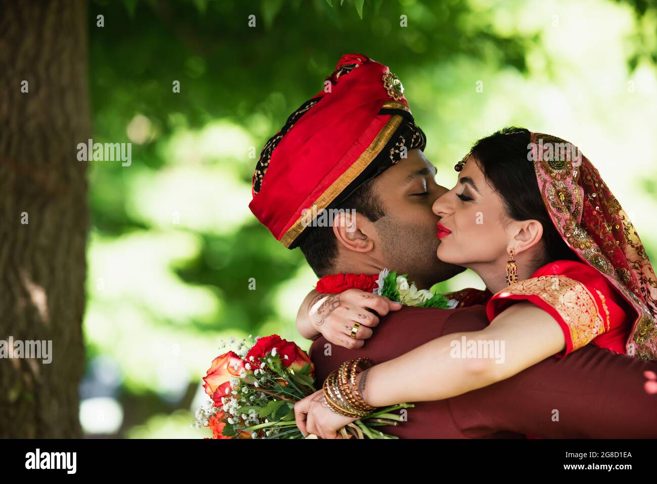 Indian young couple kissing hi-res stock photography and images - Alamy