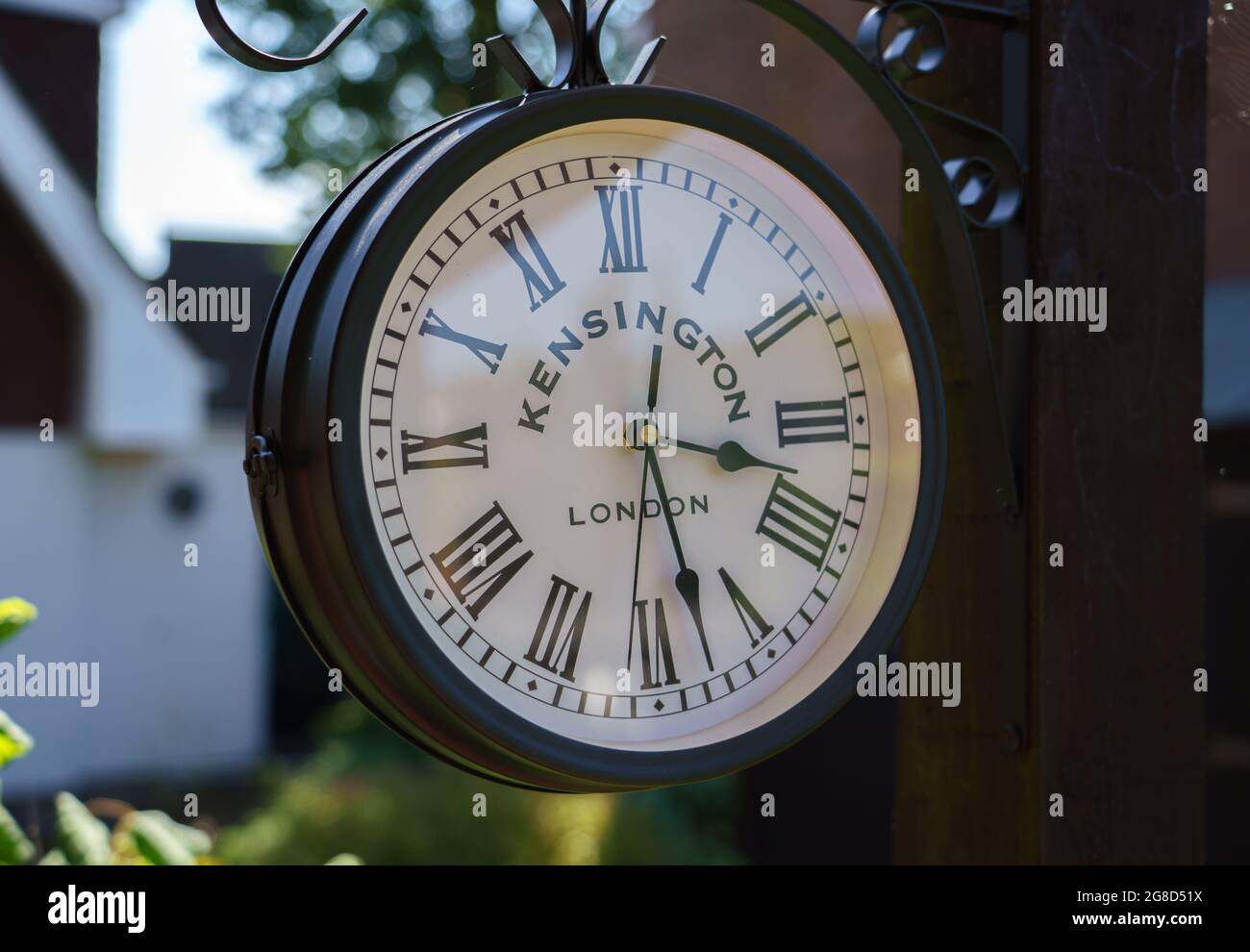 a Kensington garden clock with Roman numeral face at close to half past two Stock Photo