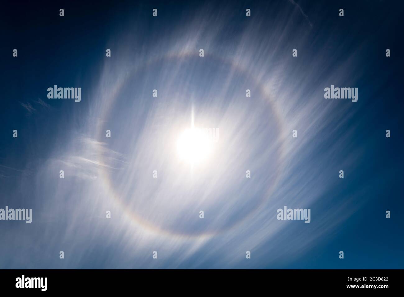 A 3 shot HDR image of a Sun Halo or 22 Degree Halo, an Atmospheric phenomena caused by ice crystals refracting light in Cirrus clouds, Scotland. Stock Photo