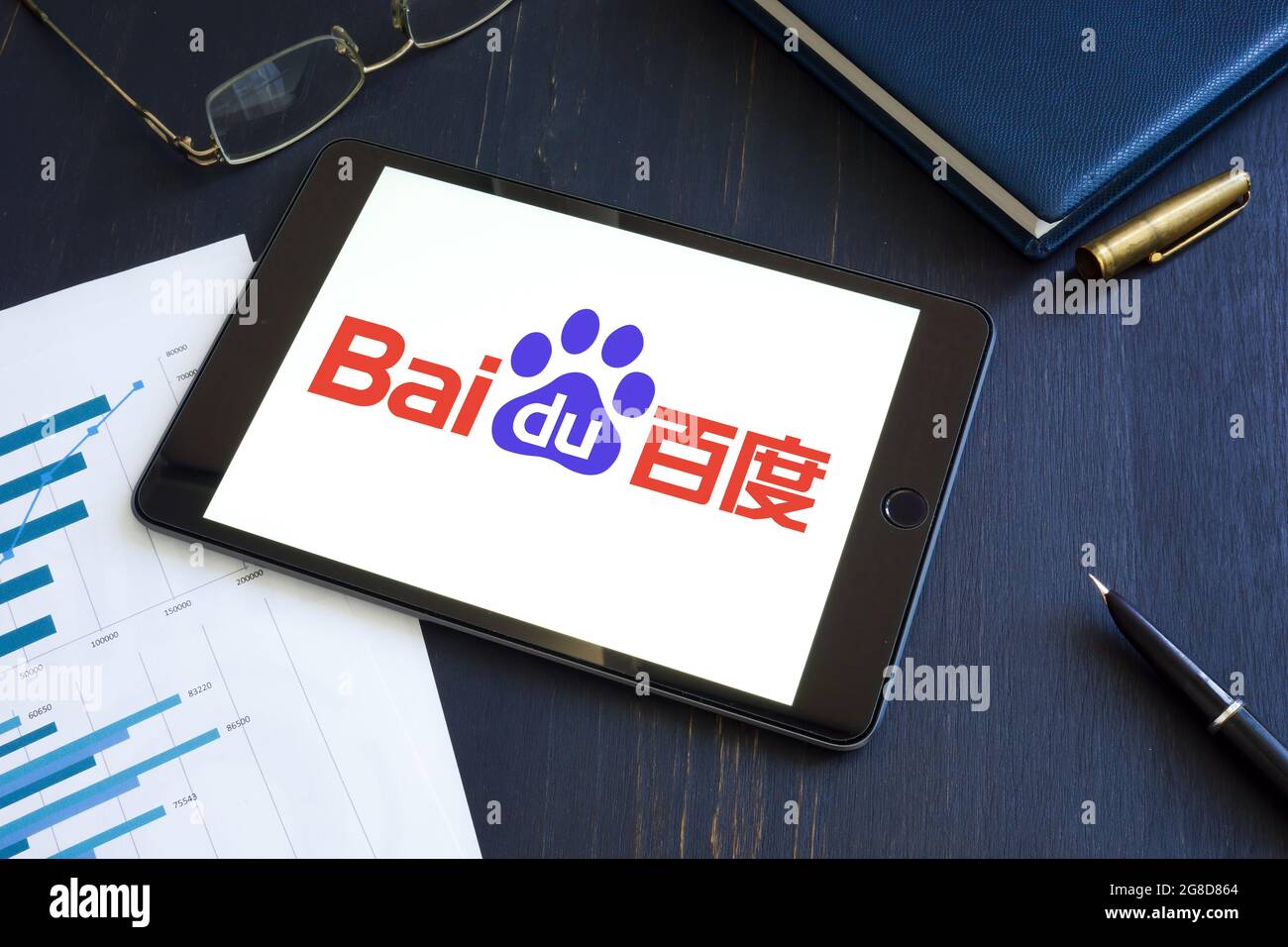 KYIV, UKRAINE - June 30, 2021. Baidu Inc BIDU company logo and papers. Stock Photo