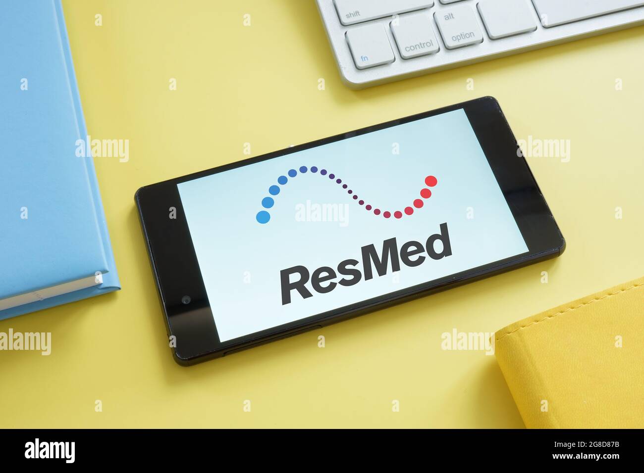 KYIV, UKRAINE - June 30, 2021. ResMed logo on the screen and tablets. Stock Photo
