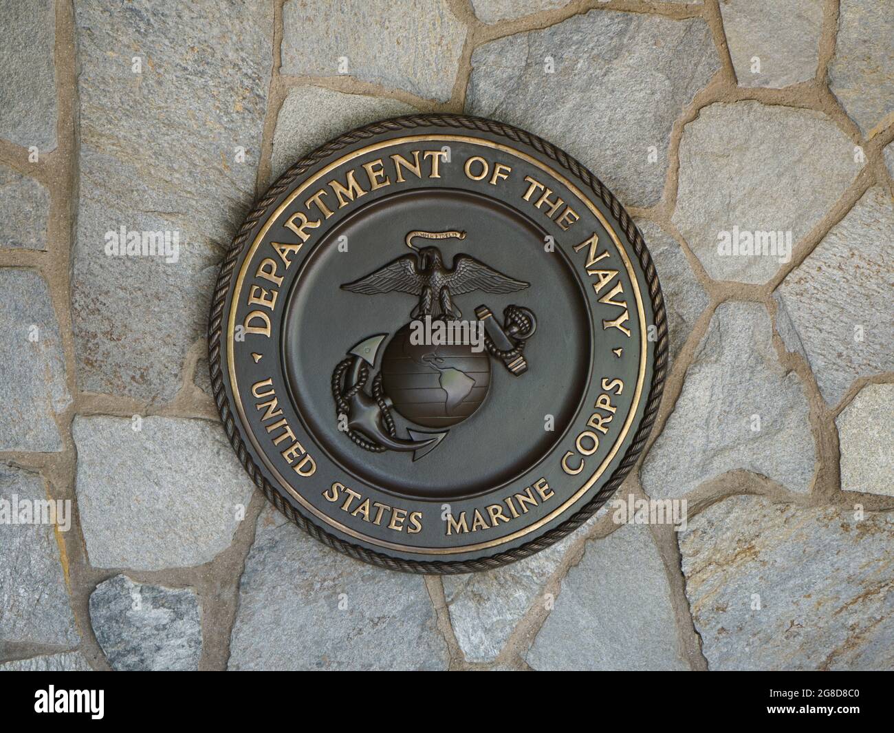 Riverside, California USA - June 16, 2021: U.S. Marine Corp seal, crest or plaque on flagstone background Stock Photo