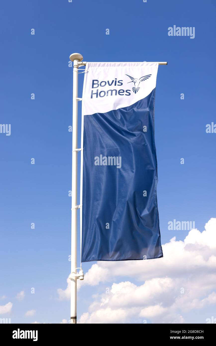 Bovis Homes advertising flag banner at a new housing development. UK Stock Photo