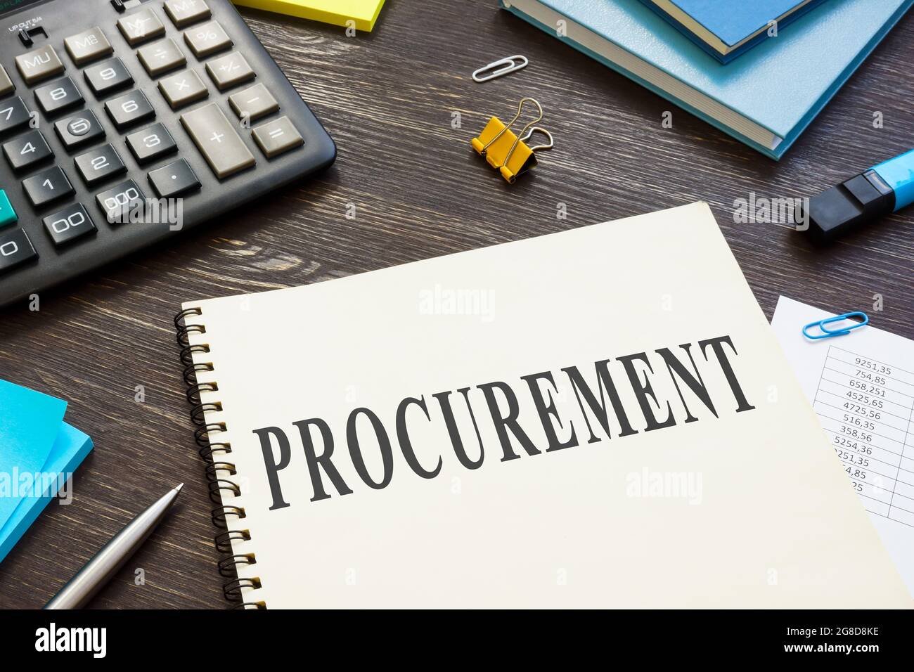 Information about procurement process in the book on the desk. Stock Photo