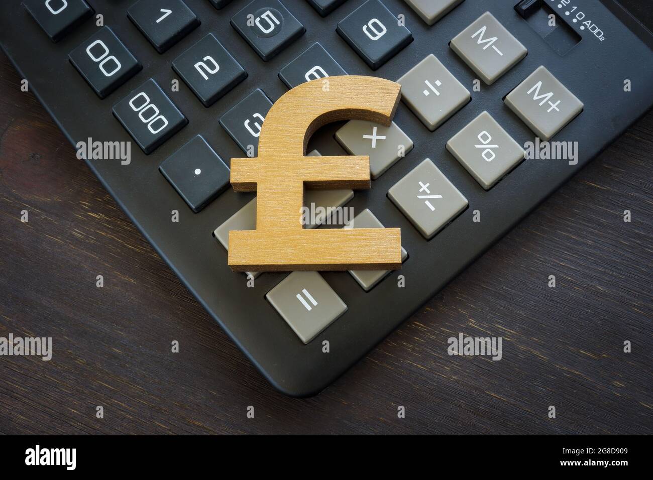 Pound sterling sign on a calculator as a symbol of currency exchange
