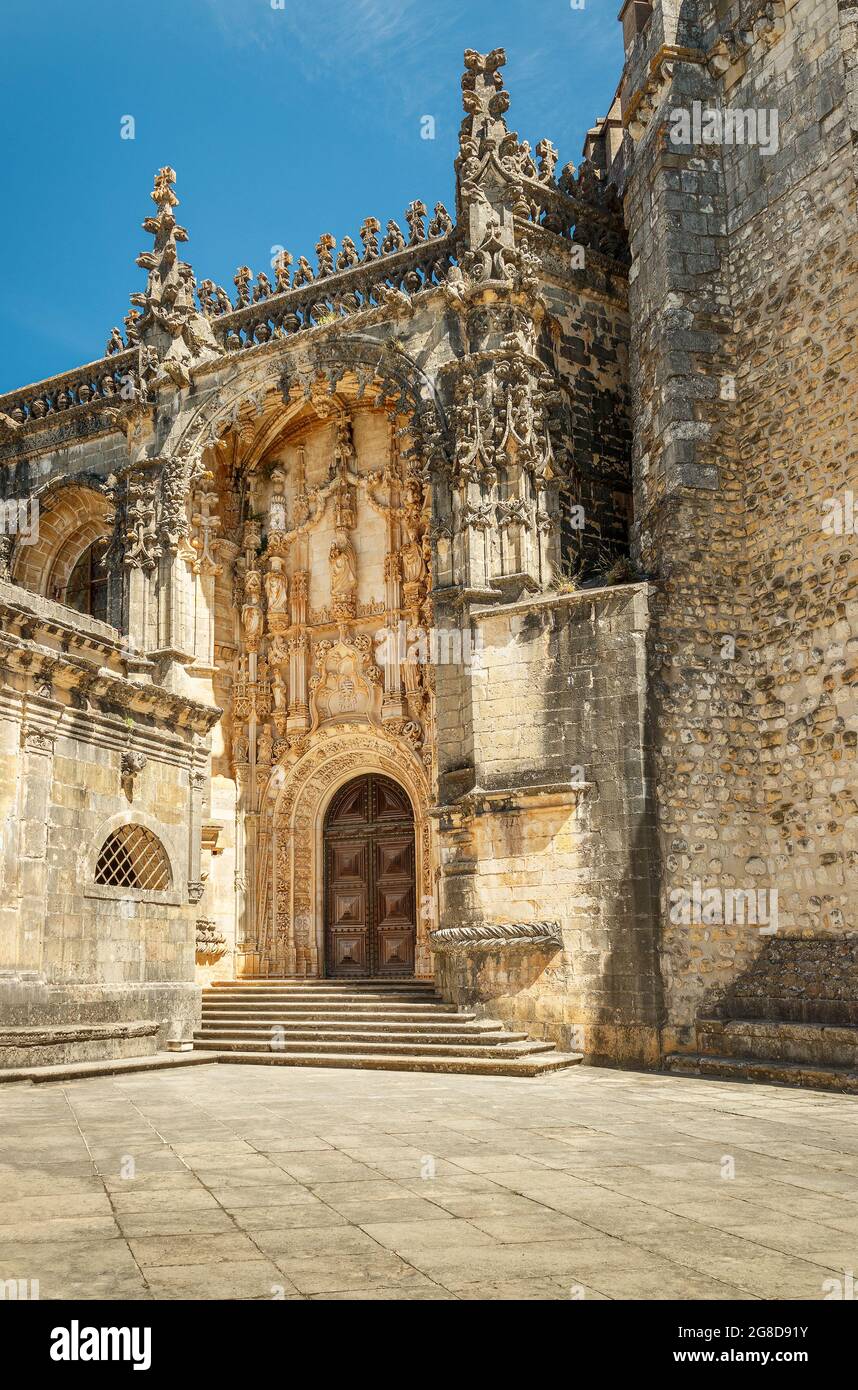 Tomar, Portugal - June 3, 2021: View of the entrance portal of the Manueline church of Convento de Cristo in Tomar, Portugal. Stock Photo