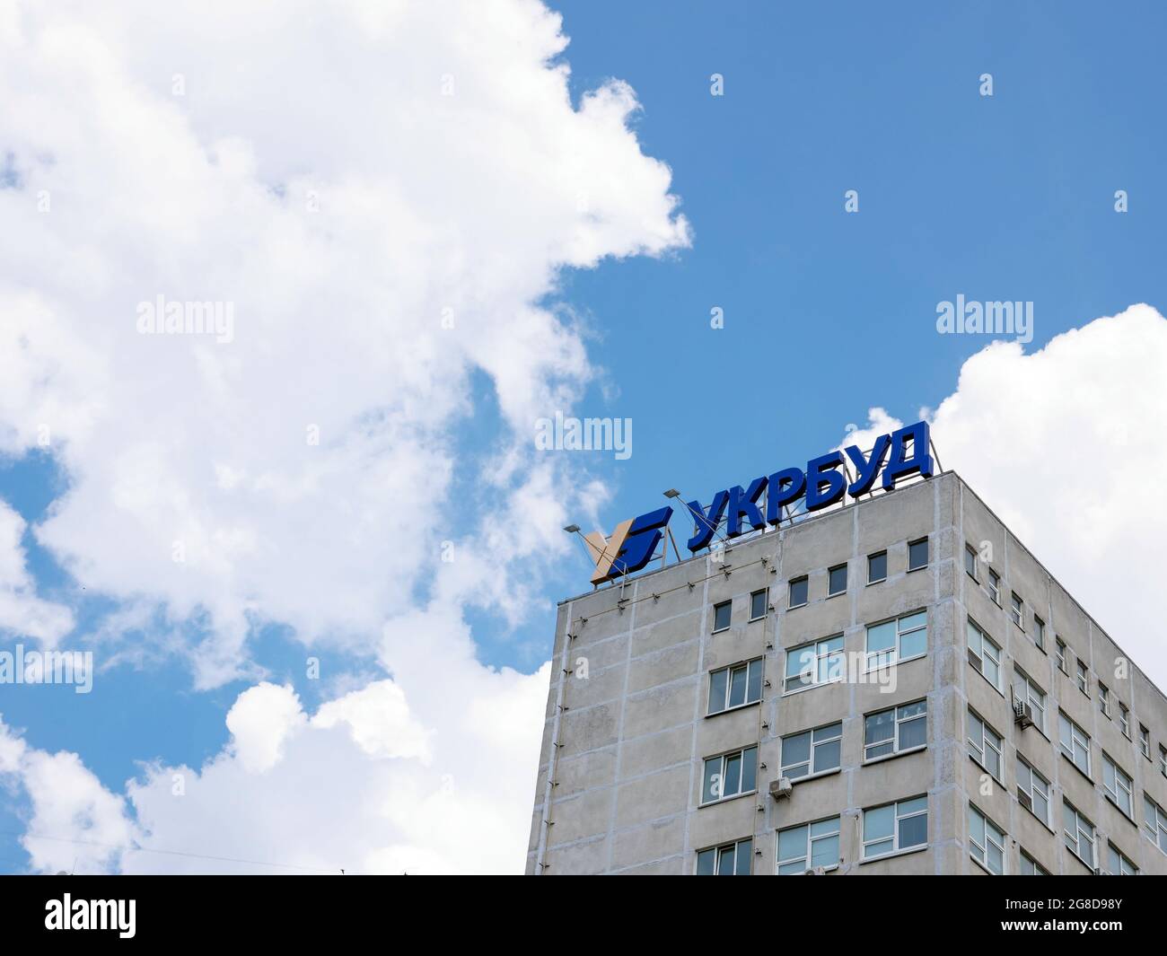 KYIV, UKRAINE - July 07, 2021. The logo of the construction company Ukrbud above the building. Stock Photo