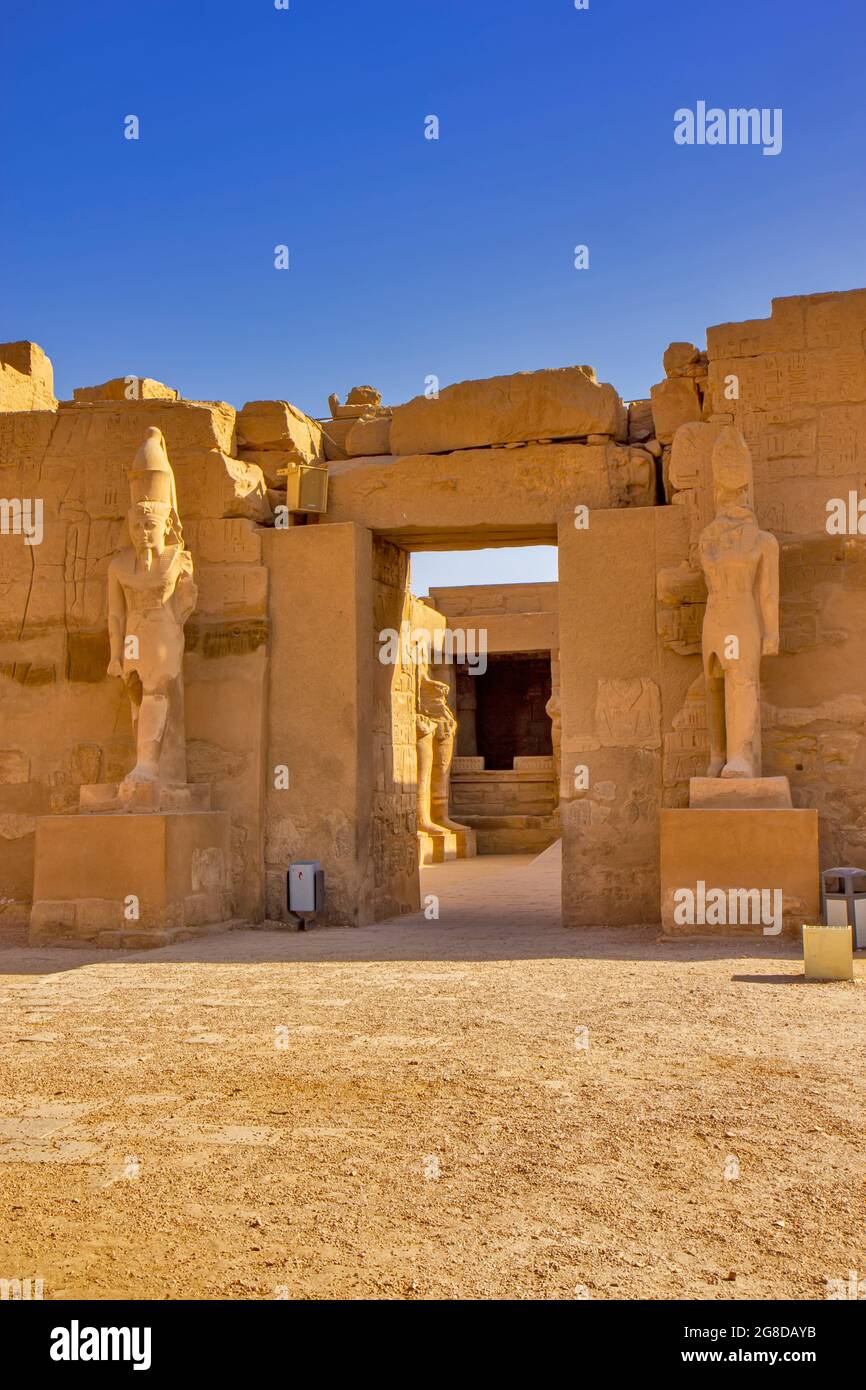 Views of the temple of Ramses III with Osiris pillars in the courtyard ...