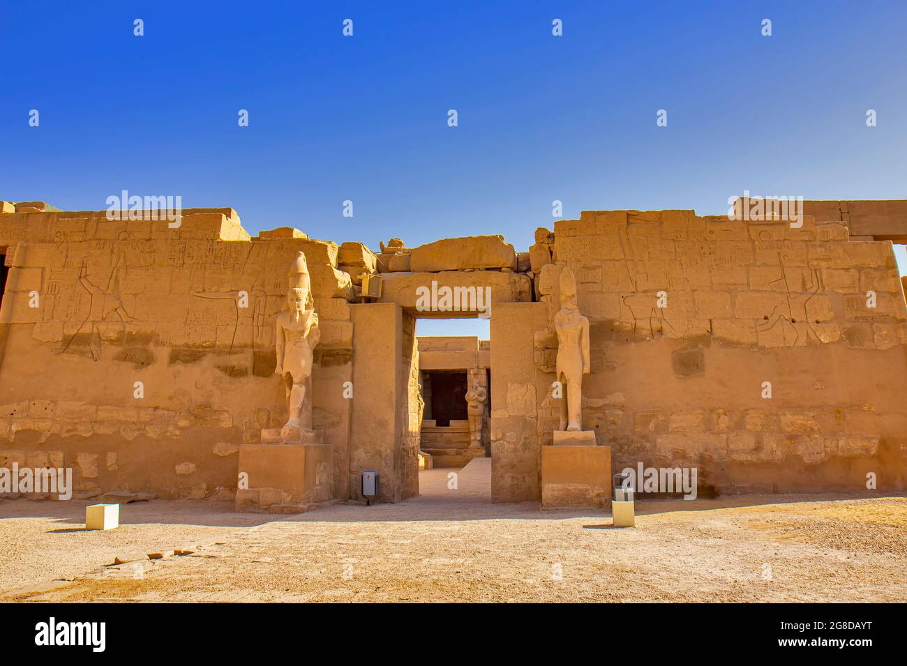 Views of the temple of Ramses III with Osiris pillars in the courtyard ...