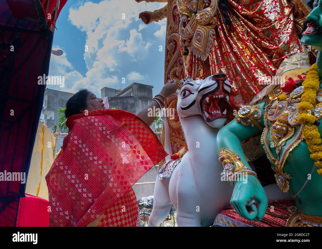 Howrah, West Bengal, India- 8th October 2019 : Vijayadashami, married Bengali Hindu woman offering sweets to Goddess Durga and praying to Her. Durga p Stock Photo