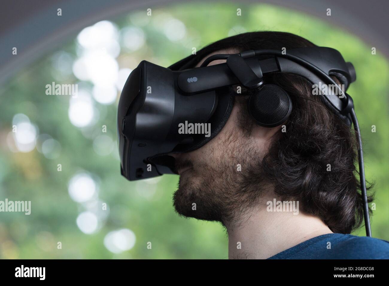 A young man wearing virtual reality headset. Stock Photo