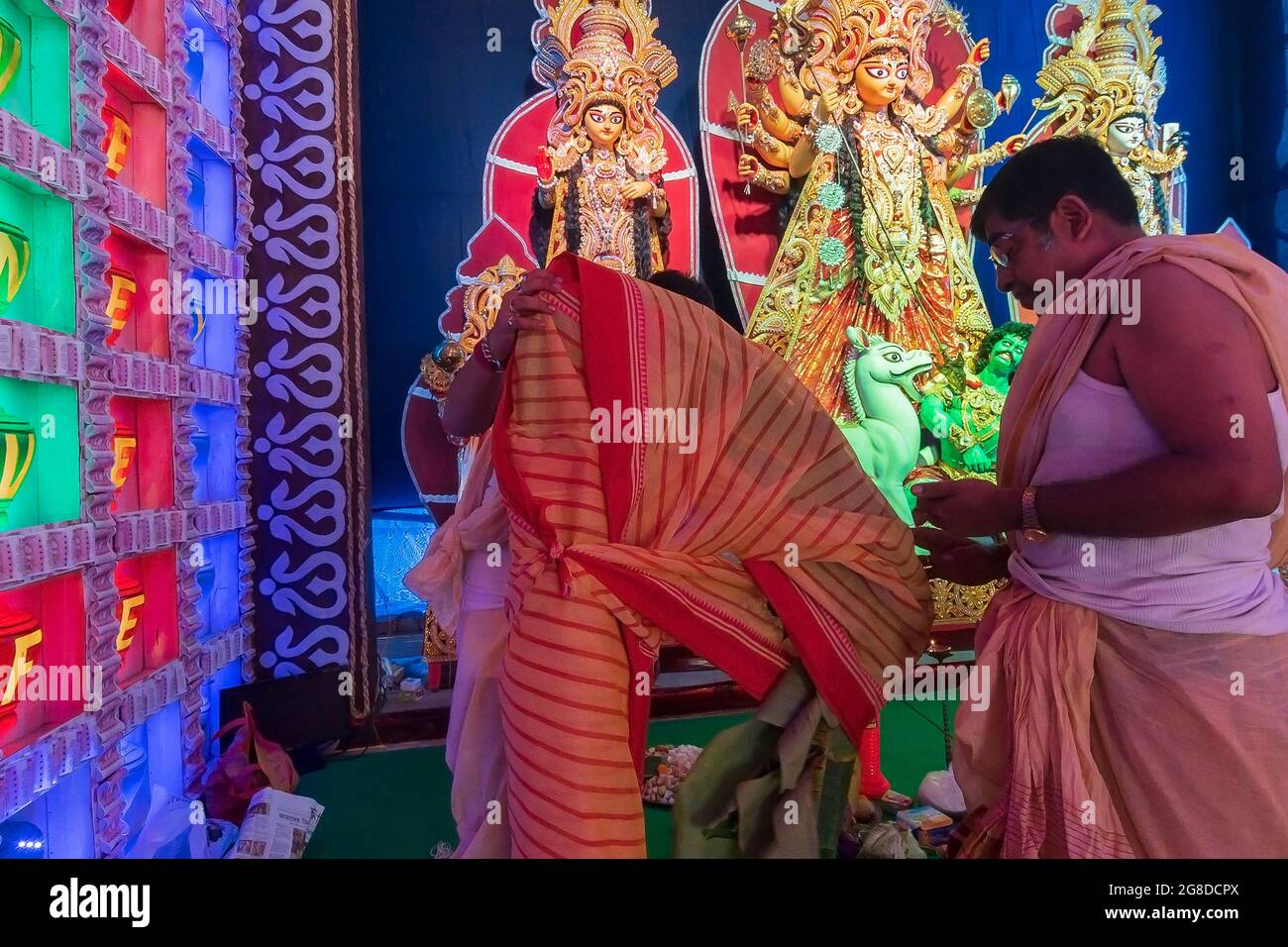 Howrah,West Bengal,India - 24th October 24 : Priests draping red
